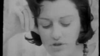 Anne Sexton at home reading Wanting to Die