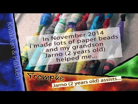 Trompke - Jarno (2) assists with making paper beads