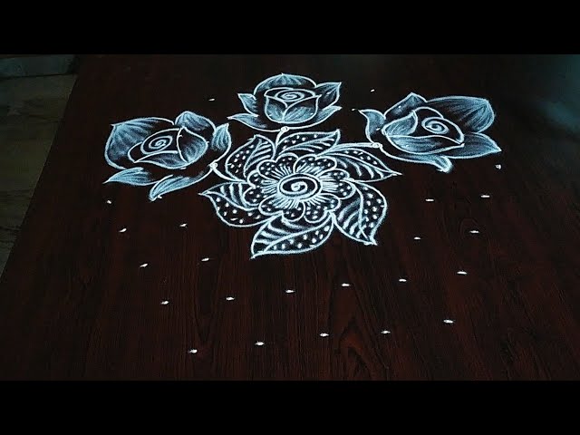 Simple rose flower rangoli design with 9 dots by aryaani designs