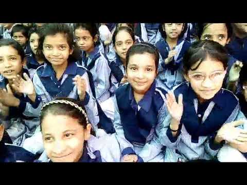 Musfirah is watching puppet show in school