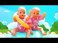 Baby Annabell -nukke & lapset leikkimässä vauvanukeilla rannalla. Baby Born -nukke altaalla.