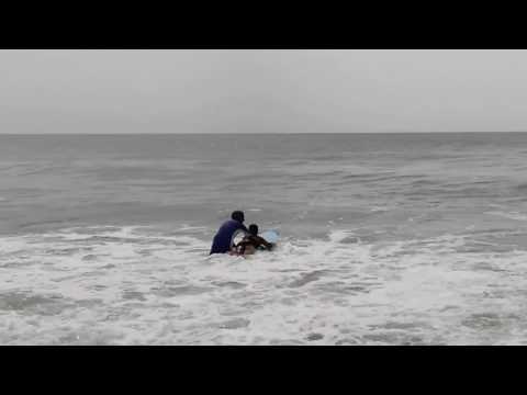 Pradyumna surfing in the sea