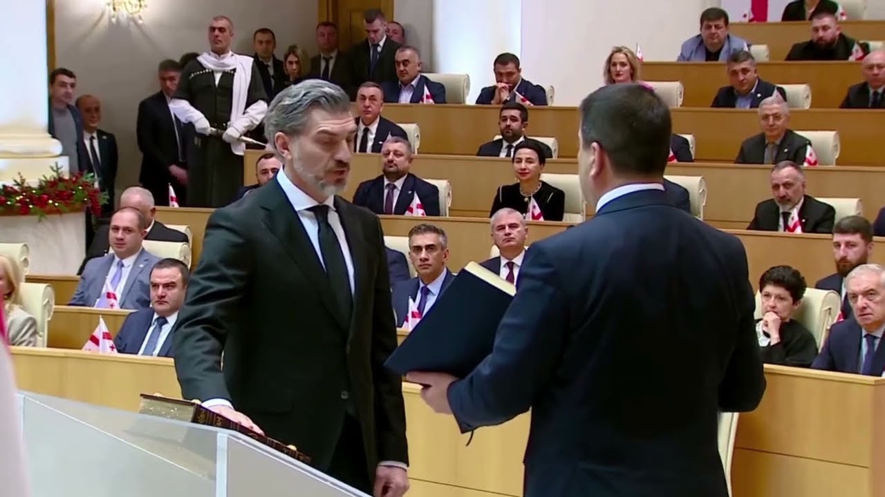 New Georgian president sworn in amid protests against legitimacy | REUTERS