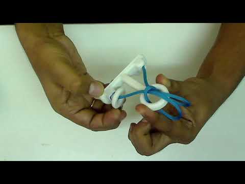 How to solve a Japanese Rope and Ring Puzzle