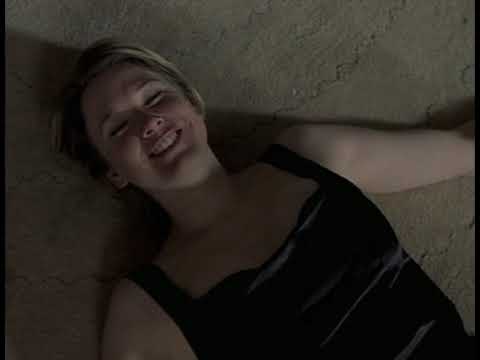 Bridget Jones’s Diary (2001) trailer still — Bridget in scarf and diary-blue titles