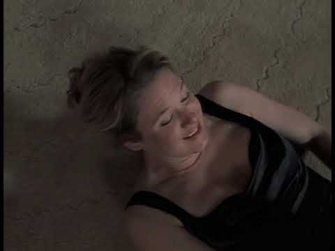 Trailer close-up — Bridget at her desk with diary, pop songs flickering in her head