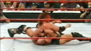 Stone Cold Steve Austin gets a full beer can thrown off his head by a fan