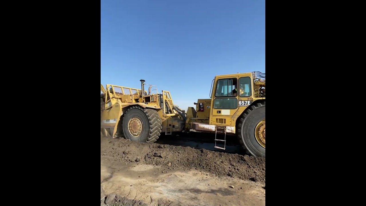 657 scraper in push pull formation scooping up 88 cubes of earth in ~45 seconds