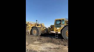 657 scraper in push pull formation scooping up 88 cubes of earth in ~45 seconds