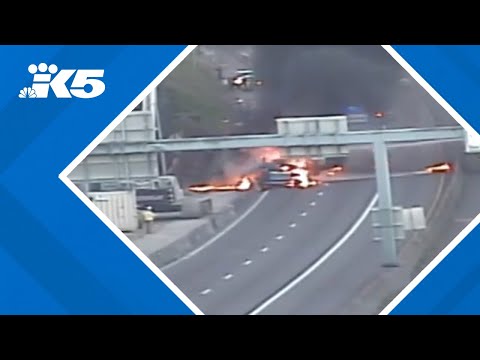 Officials say truck crash and fire on I-405 was hit and run