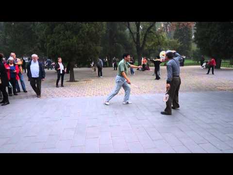 Beijing park, men playing badminton