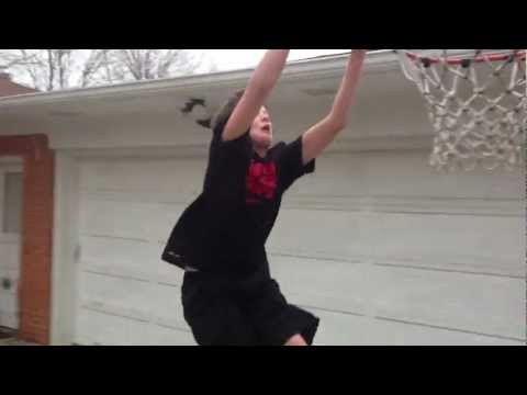 4th grader getting bounce alley oop on 8" foot