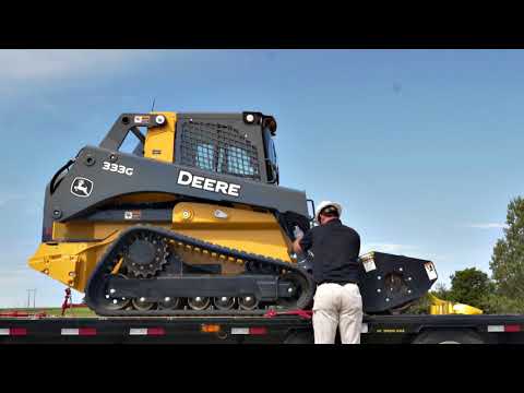 How To | Loading and Unloading a Compact Track Loader onto Trailer  | John Deere