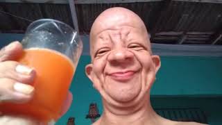 Bald wrinkly guy drink orange juice moan