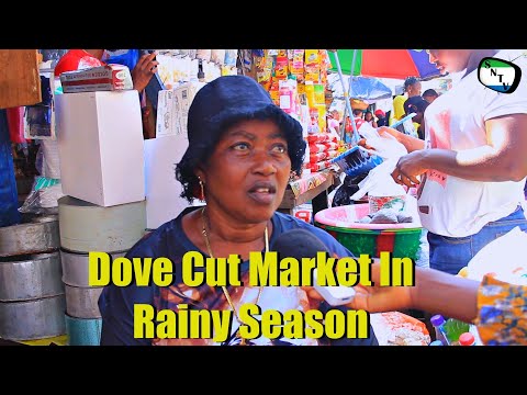 Talk To The Camera - Dove Cut Market In Rainy Season - Sierra Leone