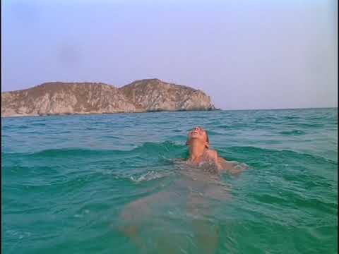 Y Tu Mamá También trailer montage still of beach dancing scene with warm lighting