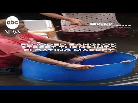 Flooded Bangkok street turns into floating market
