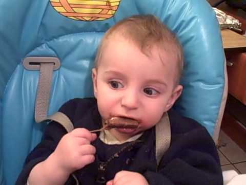Yosef eating his first bar of chocolate