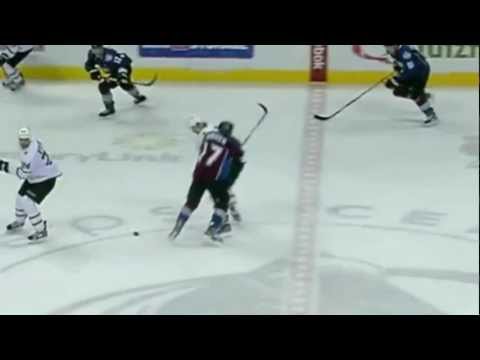 Chuck Kobasew drills Radek Dvorak