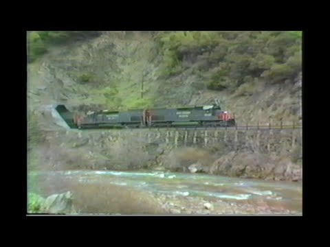 1037.  11  SOUTHERN PACIFIC SP 8542 Medford hauler at tunnel Oregon on March 20 1989 with 3 freight