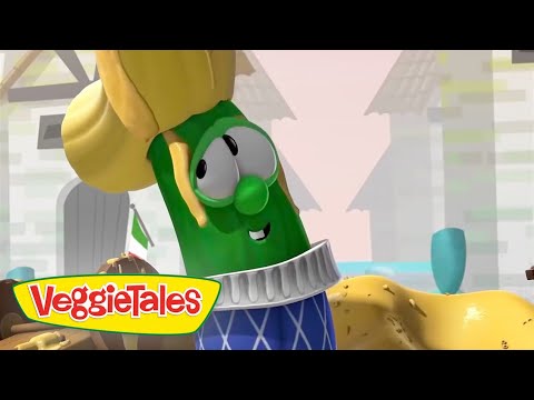 Larry the cucumber from VeggieTales wearing a blue patterned sweater and a yellow hat, smiling at the camera.