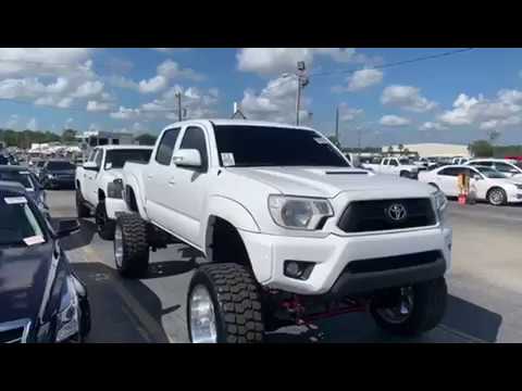 2015 Toyota Tacoma lifted on Bullet proof suspension fuel forged wheels 22X12 35 inch iron man tires