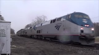 preview picture of video 'Westbound Amtrak in the Rain at Agency, Iowa'