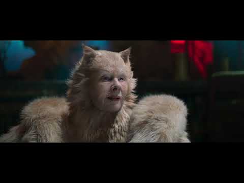 Cats (2019) official trailer frame: neon-lit London alley with Jellicle cats gathering