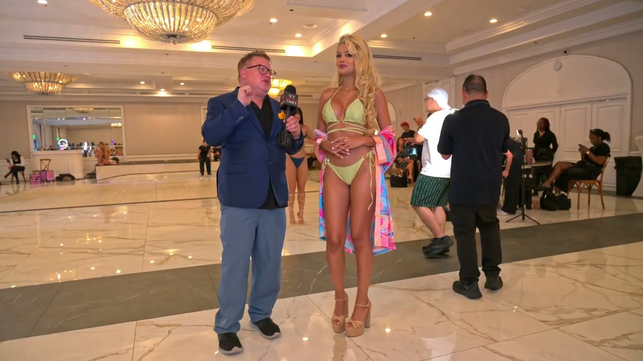 Models Luana Larkin at EXA Shows in Miami Swim Week getting ready to try on runway looks