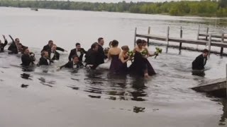 WATCH: Wedding party falls into lake when dock collapses