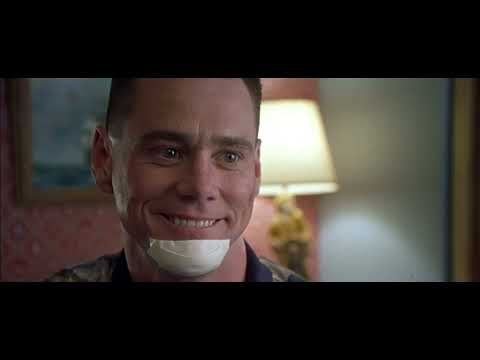 Trailer shot of Charlie riding a small motorbike with siren through town