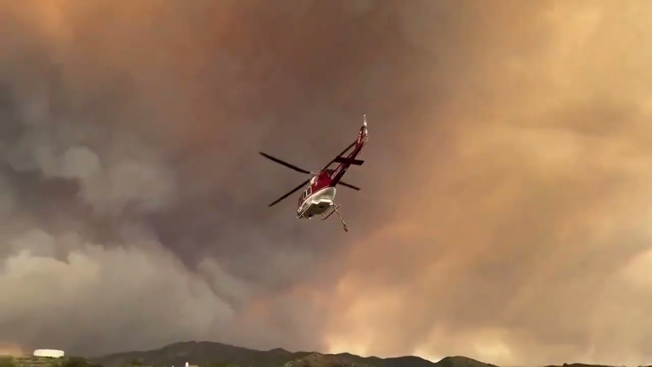 Firefighters work to control the Airport Fire in Orange County, California