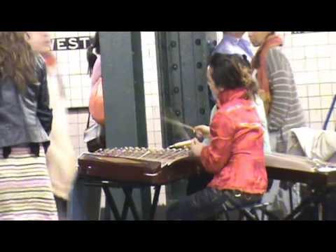 Musicians Regaling A New York City Subway Audience With The Chinese Zither & Dulcimer