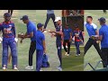 Nepal's head coach Monty Desai engages with players following the second T20 against West Indies A