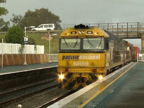 Pacific National freight train passes through Thornton station.
