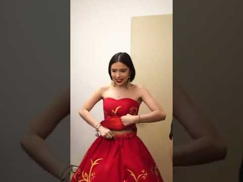 Angela Aguilar shows us how big the outfit is for her.