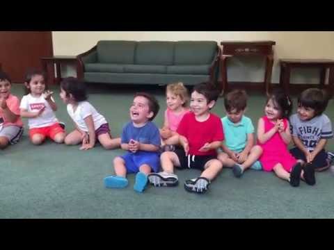 Hysterical and contagious laughing  boy in music class