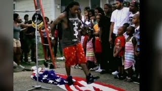 Lil&#39; Wayne steps on flag and into trouble