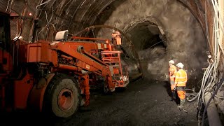 The largest tunnel in the world: miners facing the