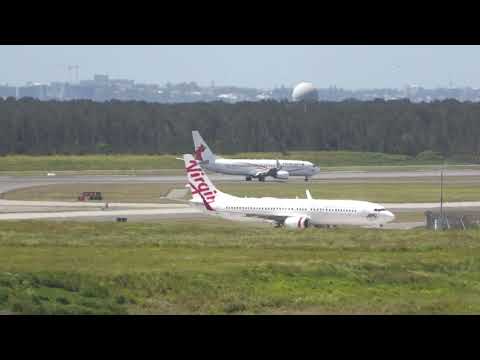 Virgin Australia and Air Nuigini 737-800 landings on the new runway at Brisbane Airport