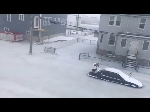 Cars freeze in floodwaters in Revere, Massachusetts