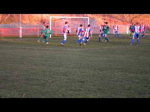 Bromsgrove's Duggan kicks away a low cross from Nirvana's Morris