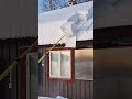 cleaning snow off the roof with a simple tool