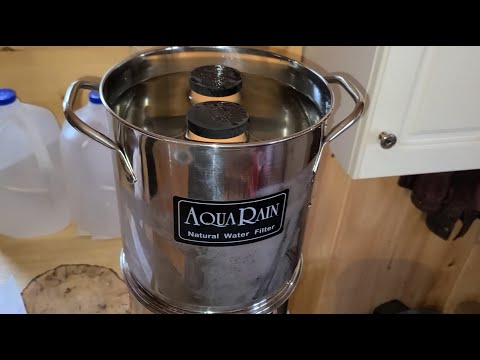 Filtering clean drinking water with the AquaRain filter at the cabin