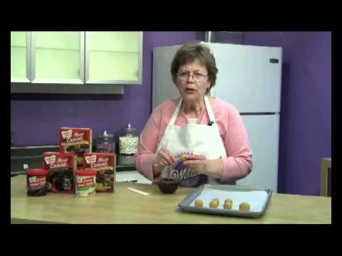 Part of a video titled CakePopFun - Inserting a Stick in a Cake Pop - YouTube