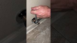Installing a new compression quarter turn angle stop and stainless steel braided supply line.