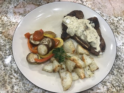 Pan seared pork chops | in mushroom white wine cream sauce