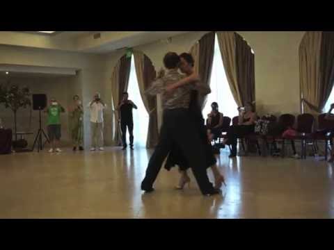  Michelle Marsidi  and  Joachim Dietiker  are  dancing  to  "  Cotorrita de la suerte  "  by  Aníbal Troilo  at  Catania Tango Festival  in  2016