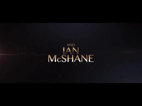 Trailer still — townsfolk cheer under string lights; a hoedown fiddle kicks