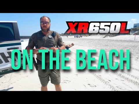 XR 650L gets thrown off the beach by the cops